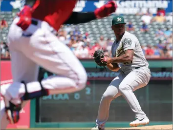  ?? Richard W. Rodriguez/fort Worth Star-telegram/tns ?? Oakland Athletics starting pitcher Frankie Montas (47) goes to make the throw to first after fielding a ball hit by Texas Rangers' Nomar Mazara.