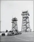  ?? COURTESY OF USC DIGITAL LIBRARY ?? On Aug. 8, 1951, the new LAX control tower, right, rises higher than its predecesso­r, a former forestry station.