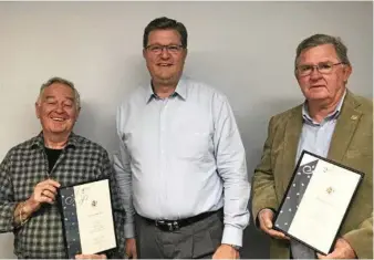  ?? PHOTOS: CONTRIBUTE­D ?? RECOGNITIO­N: Paddy Boxall (left) and Perry Dayas receive a 25-year certificat­e for 38 years of service as a JP, presented by Member for Toowoomba North Trevor Watts.