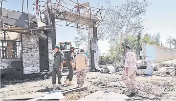  ?? — Reuters photo ?? General view of damages after a suicide car bombing outside a police station in Chabahar, Iran.