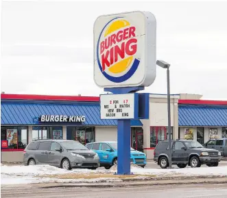  ?? DAVID ROSSITER/THE CANADIAN PRESS ?? This Burger King location in Lethbridge was open for business as usual on Wednesday after Alberta Health Services inspectors issued a health order in relation to foreign workers found sleeping in the basement. In a statement, the fast-food restaurant...