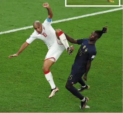  ?? — reuters/afp ?? Fierce battle: Tunisia’s Wahbi Khazri (left) in action against France’s eduardo camavinga during the Group d match at the al rayyan stadium. Inset: mathew Leckie scored the winner for australia.