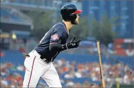  ?? Alex Brandon Associated Press ?? BRYCE HARPER, the 23- year- old National League MVP, sees nothing wrong with f lipping a bat. Mike Trout, a grizzled 24, takes the opposing view.