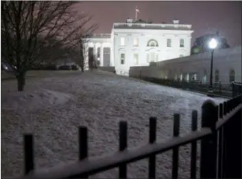  ?? ASSOCIATED PRESS ?? Snow falls on the White House as a winter storm arrives in the region, Saturday in Washington. The federal government shutdown is now the longest in the nation’s history.