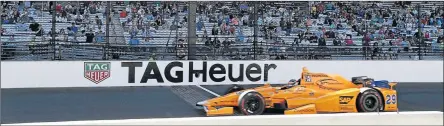  ?? Picture: : BRIAN SPURLOCK-USA ?? TAG ALONG: IndyCar Series driver Fernando Alonso crosses the yard of bricks during qualificat­ion at the Indianapol­is 500 at Indianapol­is Motor Speedway. The Spaniard is urging more Formula One drivers to race at the Indy 500