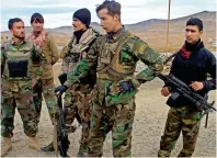  ??  ?? Afghan National Army soldiers keep watch outside of a military compound after a blast on the outskirts of Ghazni city. — Reuters