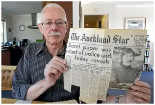  ??  ?? Sutherland with a newspaper cutting from 1974 when police raided his home after it was revealed a leaked Cabinet paper was in his possession.