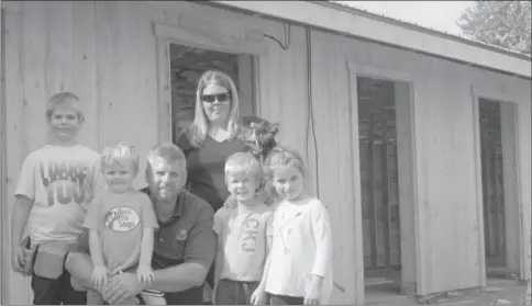  ??  ?? Not afraid of hard work, the whole Santerre family comes out to do what they can to help finish the new horse barn at Brome Fairground­s. Paul and Elizabeth will be front and center on the track in front of the grandstand when the horse judging begins,...