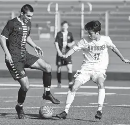  ?? PAUL W. GILLESPIE/CAPITAL GAZETTE ?? Severna Park’s Jay Pierce controls the ball as Arundel’s Aiden Koch defends in the first half of Tuesday’s game.