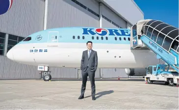  ?? BLOOMBERG ?? Walter Cho, president of Korean Air Lines, poses for a photograph in front of the carrier’s Boeing 787-9 Dreamliner passenger aircraft during a media preview at the Incheon Internatio­nal Airport yesterday.