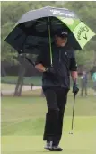  ?? AP PHOTO ?? PLAYIN’ IN THE RAIN: Phil Mickelson walks off the fifth green during play yesterday at the Dell Technologi­es Match Play in Austin, Texas.