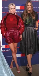  ??  ?? Singer Pixie Lott and model Amber Le Bon pose for photograph­ers ahead of the Tommy Hilfiger fashion in London on Sunday.
