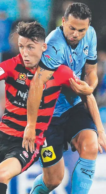  ?? Picture: MARK EVANS ?? Scott Neville of the Western Sydney Wanderers (left) doing his best to shake Sydney FC opponent Bobo as they battle for possession in last night’s A-League clash at ANZ Stadium