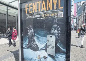  ?? JONATHAN HAYWARD THE CANADIAN PRESS FILE PHOTO ?? An advertisem­ent in downtown Vancouver in 2017 warns that abuse of the powerful opioid fentanyl can be deadly. Government figures show more than 15,000 Canadians have died of opioid overdoses since 2016.