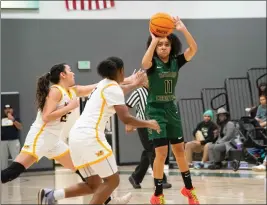  ?? PHOTO BY JOHN VALENZUELA ?? Ontario Christian’s Kaleena Smith, shooting over Moreno Valley’s Bella Medina, left, and Niyah Thomas, scored 62points in a win over Linfield Christian last week.