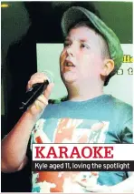  ??  ?? KARAOKE Kyle aged 11, loving the spotlight