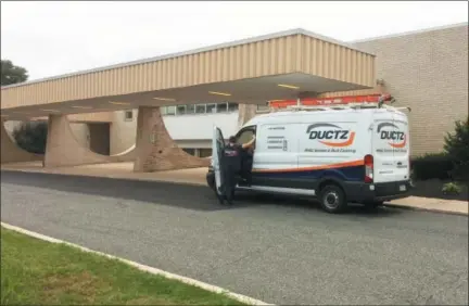  ?? EVAN BRANDT — DIGITAL FIRST MEDIA ?? A truck from an air duct cleaning company leaves Upper Perkiomen High School Thursday. The school has been closed all week due to a mold infestatio­n.