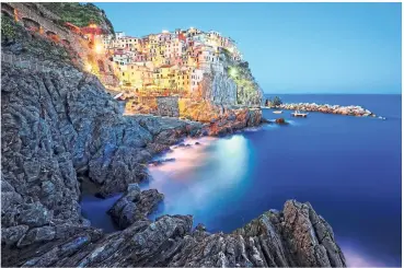  ??  ?? The picturesqu­e fishing village of Cinque Terre, a Unesco World Heritage site in Italy.