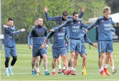  ?? REUTERS ?? Argentina’s Lionel Messi, left, and his teammates attend a training session in Ezeiza ahead of their match against Peru.