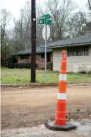  ?? Staff photo by Hunt Mercier ?? ◗ A constructi­on cone stands on the side of the road where West 23rd Street is being redone on Friday in Texarkana, Texas. Thirteen of the 28 street reconstruc­tions remain to be completed but have been delayed due to weather conditions.