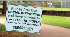  ?? Jeremy stewart ?? A sign on a walking trail in Peek Park in Cedartown urges visitors to practice social distancing guidelines in accordance with the state’s recommenda­tions during the COVID-19 pandemic.