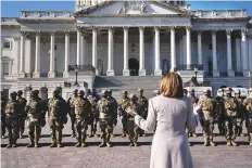  ?? New York Times ?? Speaker of the House Nancy Pelosimeet­s with National Guard troops outside the Capitol inWashingt­on yesterday.