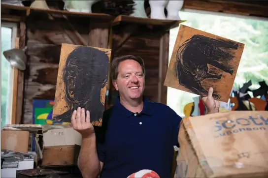  ?? (JR Delia/Legacy List via The Washington Post) ?? “Legacy List” host Matt Paxton holds up pieces from artist David Hayes at his studio in Coventry, Conn., in an episode from season two of the show.