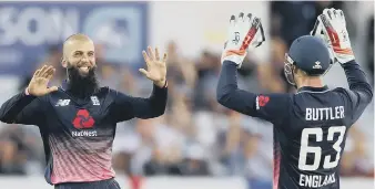  ??  ?? Moeen Ali celebrates with Jos Buttler after taking the wicket of South Africa’s Chris Morris at Hedingley