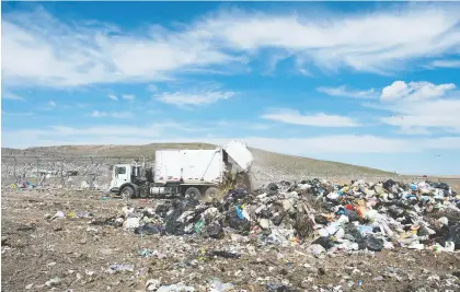  ?? TROY FLEECE FILES ?? A garbage truck unloads at the City of Regina landfill, where half the garbage received is food and yard waste.