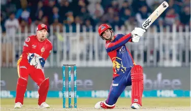  ?? Associated Press ?? ↑
Karachi Kings’ Alex Hales (right) plays a shot as Islamabad United wicket-keeper Luke Ronchi looks on during their PSL match on Sunday.