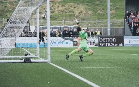  ?? ?? OPENING BLAST: Michael Coulson’s shot flies past a diving Dan Atherton in the Warrington Town goal