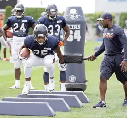  ?? | AP ?? Bears running back Jacquizz Rodgers takes part in a drill during a joint practice with the Patriots in Foxborough, Mass.