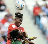  ?? REUTERS/HANNAH MCKAY ?? AERIAL BATTLE: Switzerlan­d’s Breel Embolo rises above Cameroon’s Andre-frank Zambo Anguissa in their Fifa World Cup Qatar 2022 Group G match at the Al Janoub Stadium in Al Wakrah on Thursday.*picture: