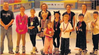  ??  ?? ●● Youngsters at the MAC Activity Centre with their trophies and medals