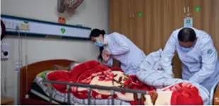  ?? ?? Medical staff provide services to a disabled elderly person at the Jinshengyi Nursing Home in Zhenhai District of Ningbo, Zhejiang Province, on January 22. Zhejiang is one of the first provinces in China to pilot the country’s long-term care insurance program