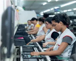  ?? ?? Workers on a production line at the SEMP TCL television factory in Manaus, Brazil, on March 13. SEMP TCL is a joint venture establishe­d by Chinese electronic­s giant TCL Technology and Brazilian home appliance manufactur­er SEMP