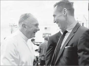  ?? Harry How Getty Images ?? BILL BERTKA, left, greets Steve Nash after the guard’s retirement announceme­nt in 2015. Bertka was an assistant for eight Lakers coaches, including Pat Riley, Magic Johnson, Kurt Rambis and Phil Jackson.