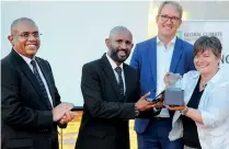  ??  ?? Naleen Edirisingh­e, DGM-Branch Credit accepting the award from Claudia Arce, Chairperso­n of the Global Climate Partnershi­p Fund. Also in the picture are Luke Franson-Head of Green Lending, GCPF and Nalaka Wijayaward­ana, DGM-Marketing, Cards & Deposit Mobilizati­on