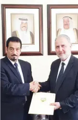  ??  ?? AMMAN: Kuwait’s Ambassador to Jordan Dr Hamad AlDuaij hands out a document to grant $758,000 worth of aid to two charitable societies in Jordan. — KUNA