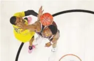  ?? Alex Gallardo, The Associated Press ?? Michigan guard Muhammad-Ali Abdur-Rahkman, left, tries to score against Texas A&M’s Robert Williams in their teams’ West Regional semifinal game Thursday night in Los Angeles.