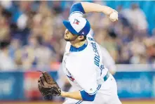  ?? MARK BLINCH, THE CANADIAN PRESS ?? Jays starter Mike Bolsinger didn’t get out of the fifth inning against the Braves in Toronto on Monday.