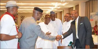  ??  ?? L - R: Ikechi Uko, Sen Liyel Imoke in a handshake with Folorunsho Coker. Behind are Minister of Informatio­n, Culture and National Orientatio­n, Alh Lai Mohammed, President NATOP, Nkereuwem Onung and Gabe Onah at NATOP AGM 2017