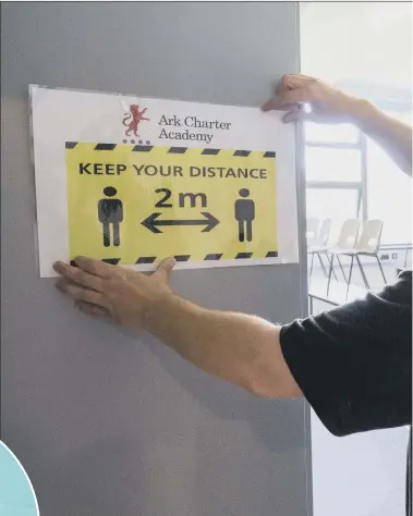  ??  ?? SAFETY MEASURES A social distancing sign is put up in a classroom at Ark Charter Academy in Portsmouth, as preparatio­ns are made before the start of the new term. Inset, left, Cllr Suzy Horton, education boss at Portsmouth City Council