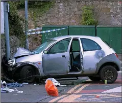  ??  ?? Carnage: The wrecked Ford Ka at the scene on Thursday