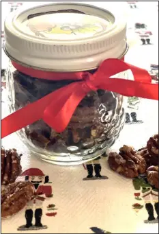  ?? CATHY THOMAS — ORANGE COUNTY REGISTER ?? Candied pecans are great eaten straight as a snack or when included in a salad.