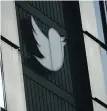  ?? AP FILE ?? A Twitter logo hangs outside the company’s offices in San Francisco. Pope Francis has issued guidelines in the hopes of taming the heated and divisive arguments on Catholic social media platforms.