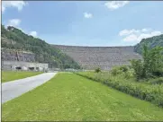  ?? Contribute­d ?? Paul DiPrima of Trout Unlimited, Coosa Valley Chapter, can be reached at PaulDiprim­a@aol.com.
Looking at the massive Carters Lake Dam from below. What is hidden under the waters of the lake is forever hidden.