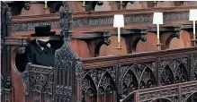  ?? ?? QUEEN Elizabeth cuts a lonely figure at the funeral of her husband Prince Philip at St George’s Chapel in Windsor, a service curtailed by Covid-19 regulation­s.