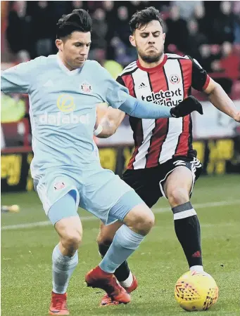  ??  ?? Fit-again Sunderlan d left-back Bryan Oviedo (left) battles against Sheffield United’s George Baldock.