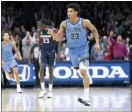  ?? CHRIS SZAGOLA — THE ASSOCIATED PRESS ?? Villanova’s Jermaine Samuels reacts to his basket during the second half of an NCAA college basketball game against Connecticu­t, Saturday in Philadelph­ia. Villanova won 61-55.